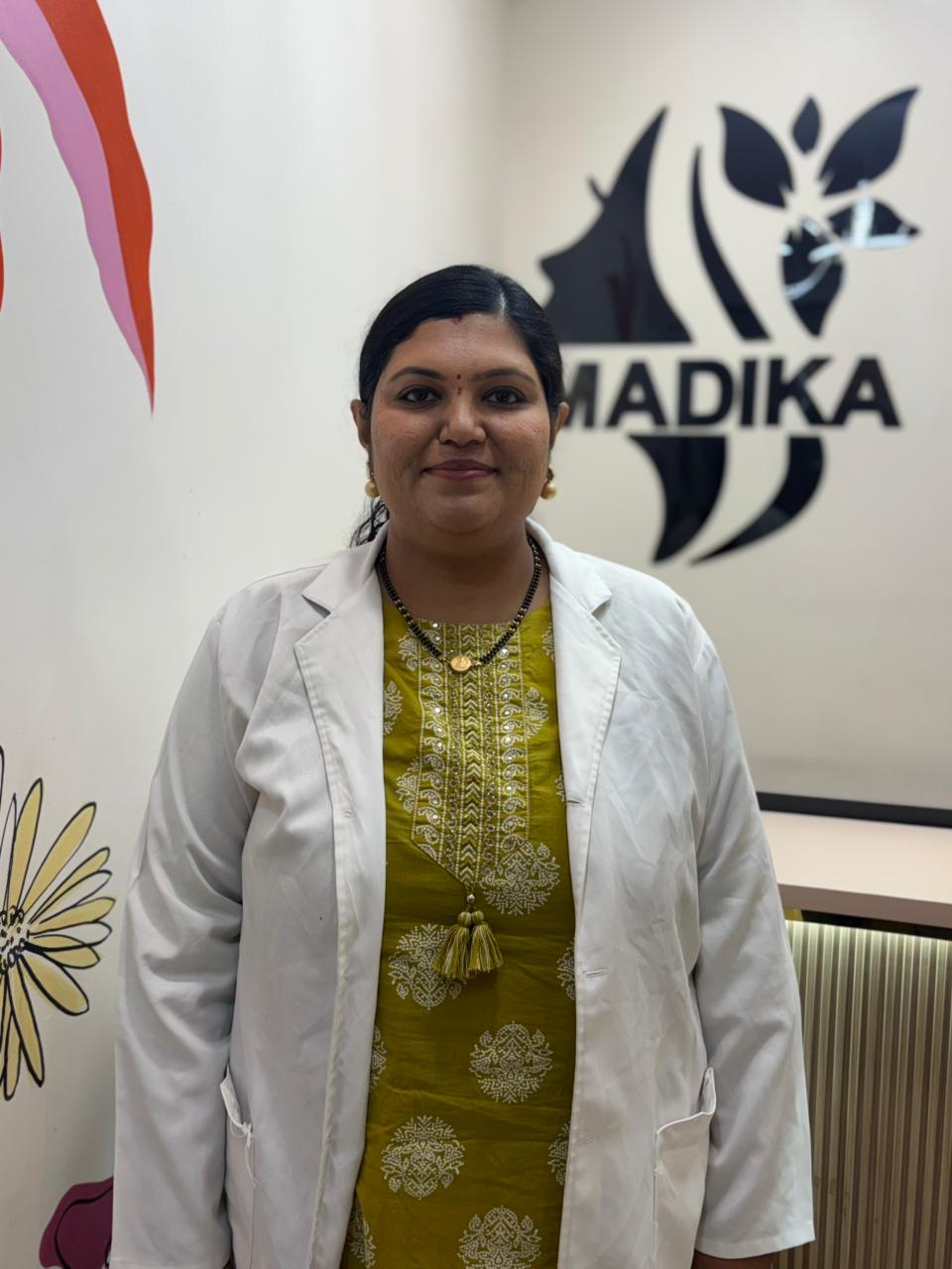 Dr. Monisha B